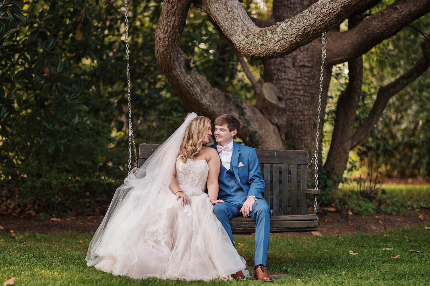 Joyful newlyweds embrace in front of Duncan Estate, their dream wedding venue.