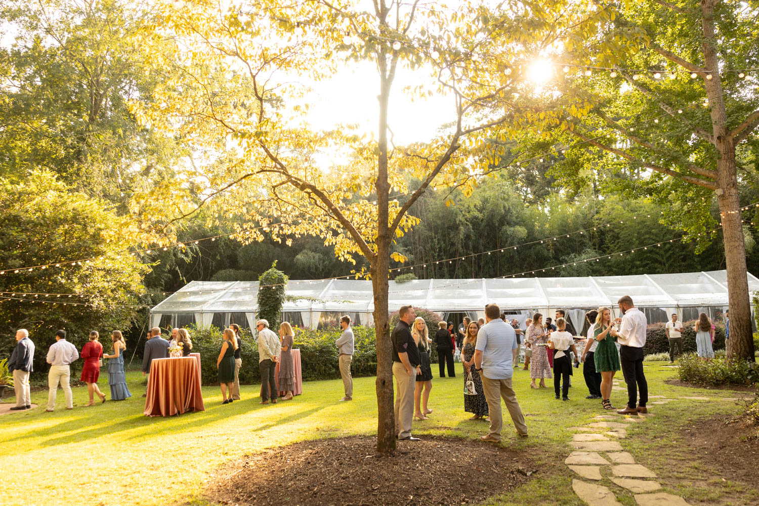 Large group of people mingling at a wedding reception