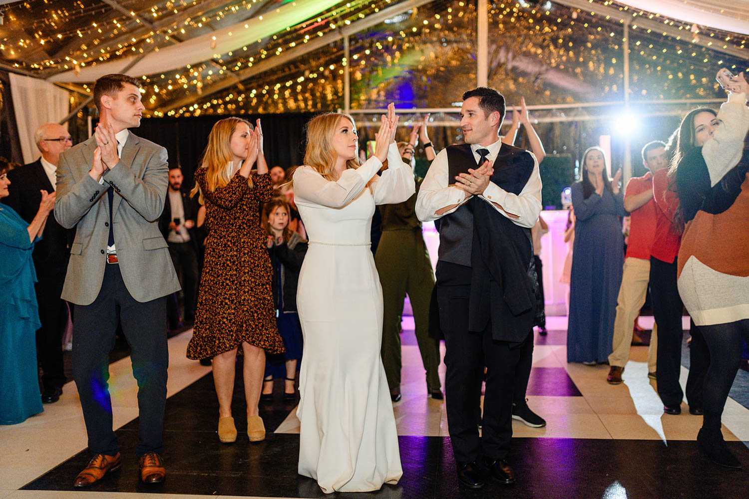 wedding couple clapping at their Duncan Estate reception