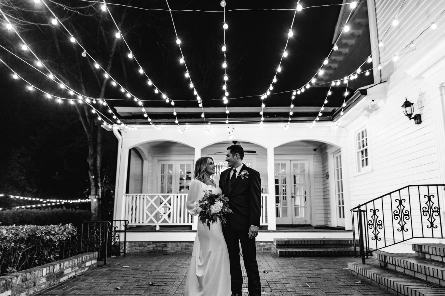 black and white picture of a couple looking at each other