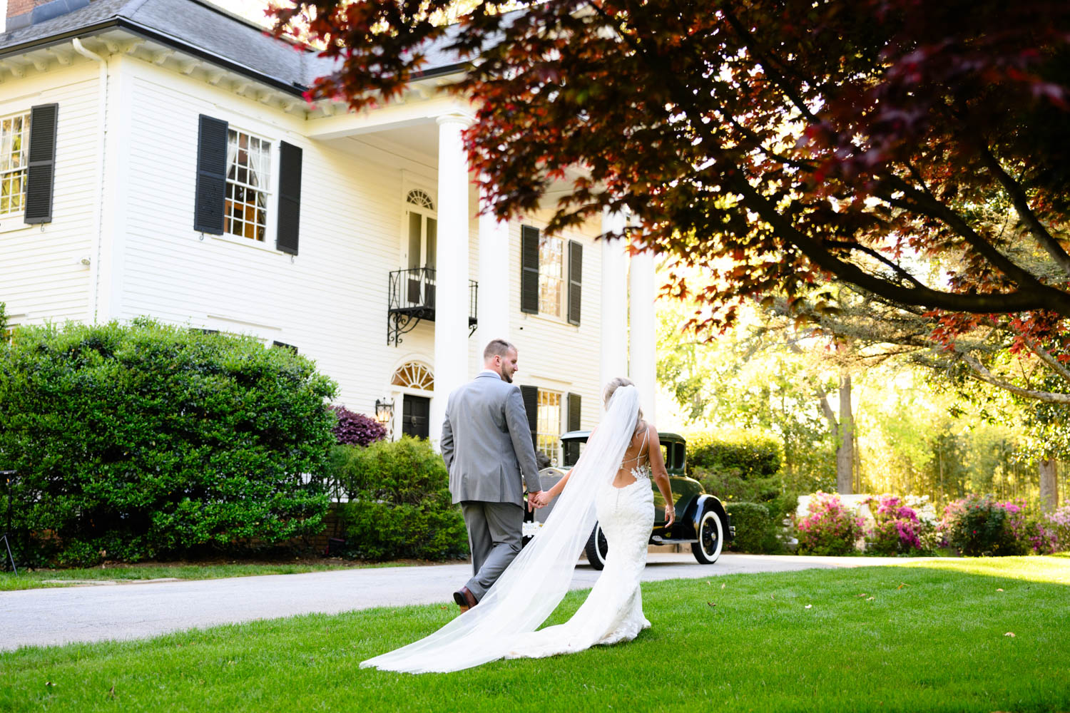 A couple walking on the front law of Duncan Estates in Spartanburg