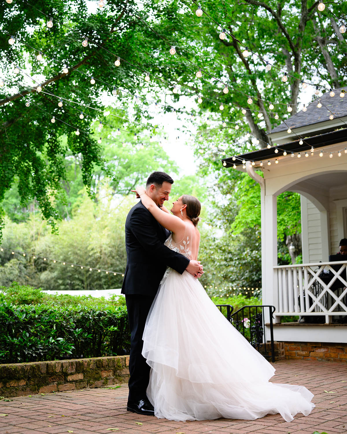 Wedding couple sharing a dance outside of Duncan Estates