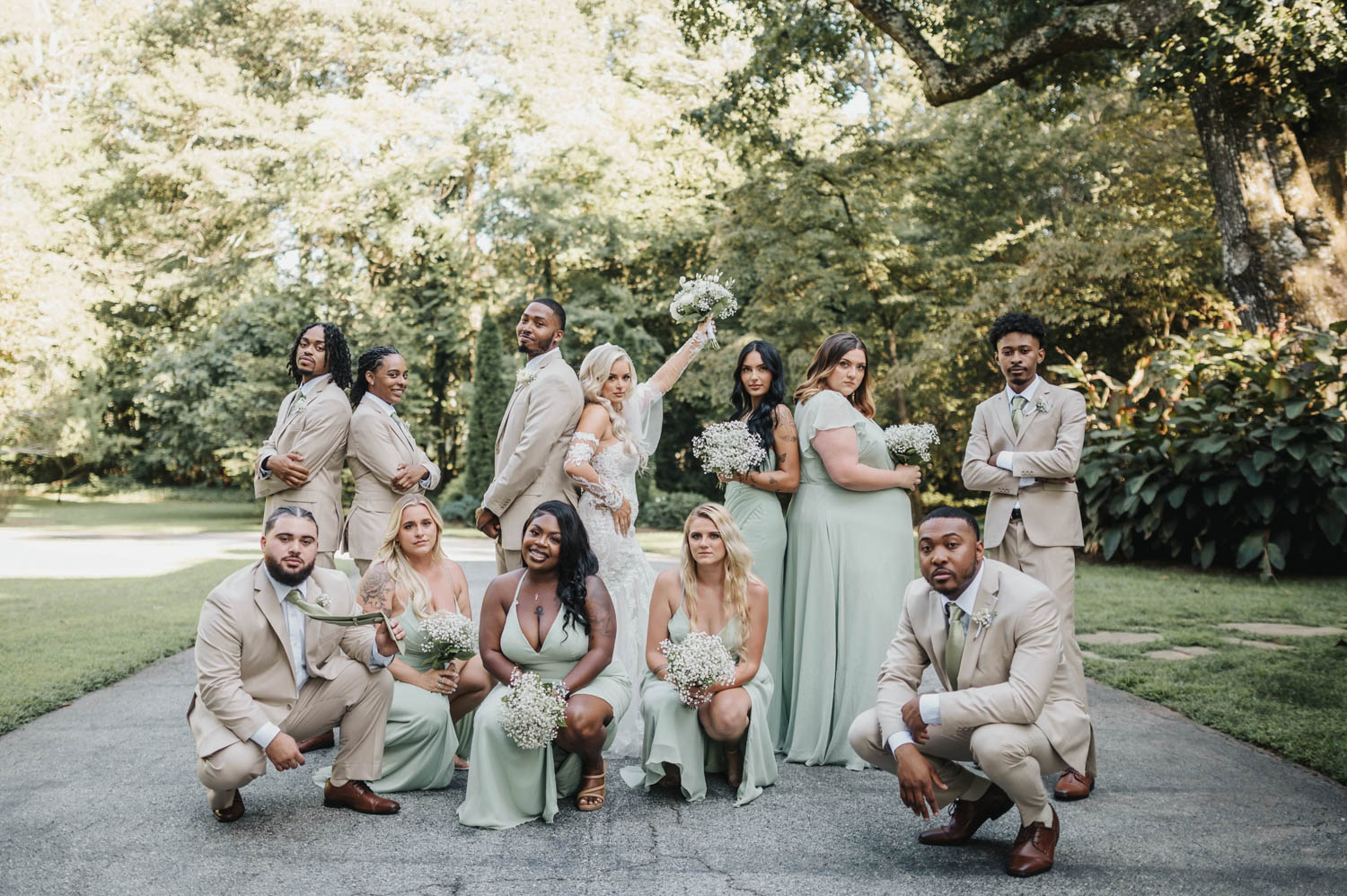 Bridal party posing for pictures in mint dresses